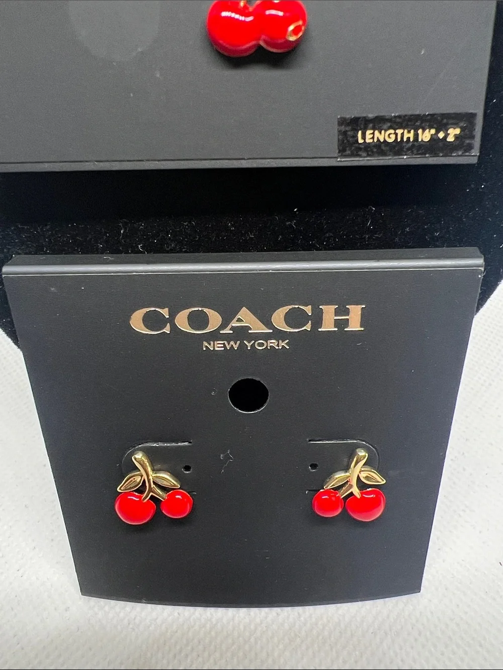 Coach gold tone